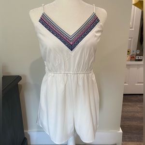 White romper with embroidered V neck